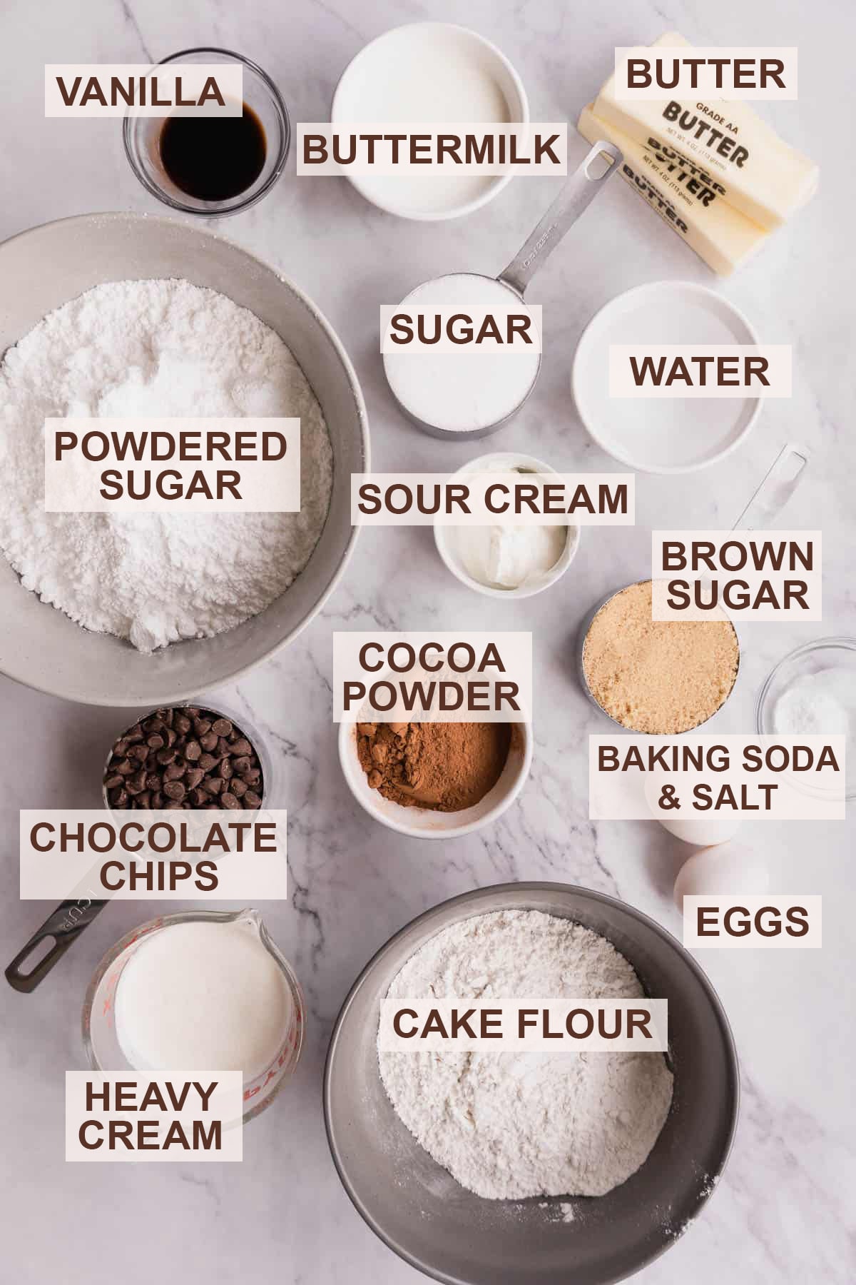 Labeled ingredient photo for chocolate ganache cake on a white backdrop.