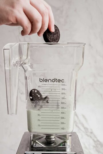adding-oreos-to-blender-for-ore-mint-shake.