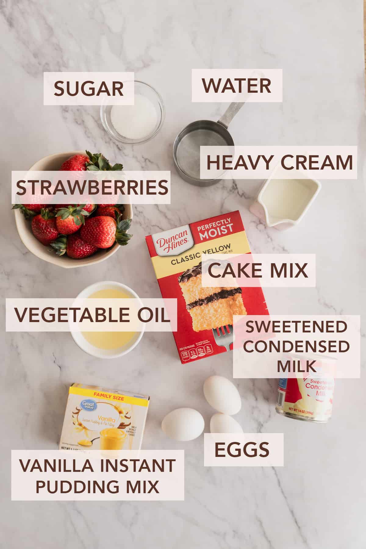 Labeled ingredients for strawberry shortcut cake on a white background.